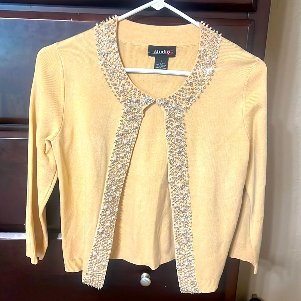 Butter Colored dressy sweater with sequins around the neck & down front.